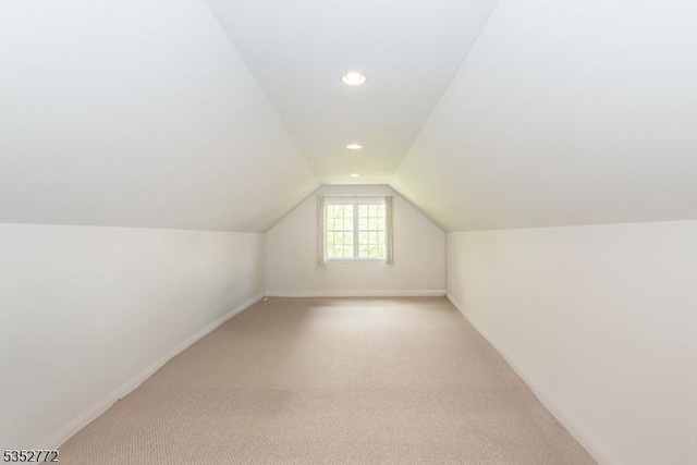 bonus room featuring lofted ceiling, light colored carpet, recessed lighting, and baseboards
