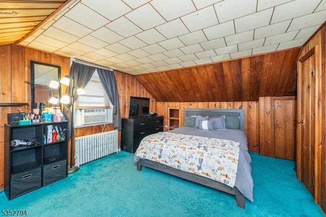 bedroom featuring radiator, wooden walls, lofted ceiling, and carpet