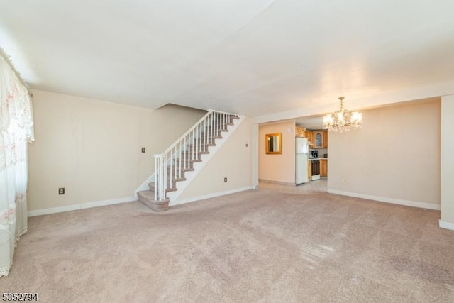 unfurnished living room with a notable chandelier, light carpet, baseboards, and stairs