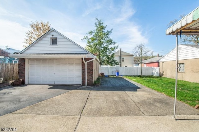 detached garage featuring fence