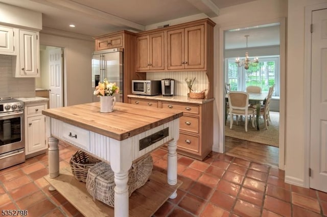 199 W Springtown Rd, Washington Twp, NJ 07853 - kitchen featuring appliances with stainless steel finishes, butcher block counters, recessed lighting, tasteful backsplash, and a chandelier