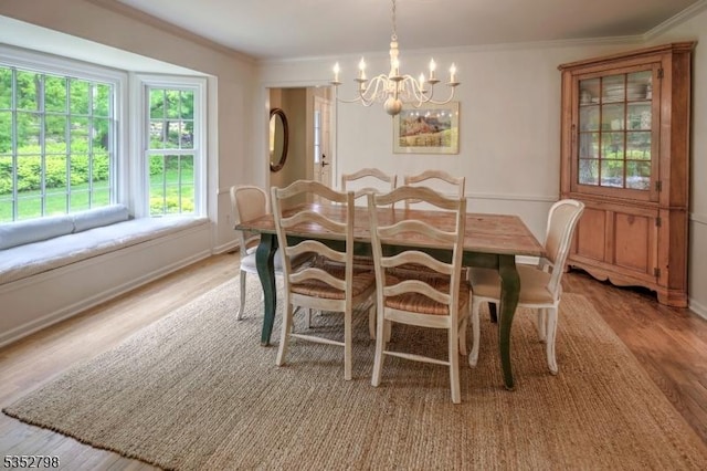 199 W Springtown Rd, Washington Twp, NJ 07853 - dining area with a chandelier, light wood-type flooring, ornamental molding, and baseboards