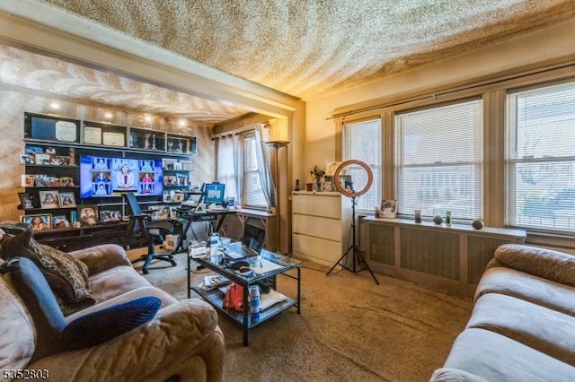 living area with a wealth of natural light and carpet floors