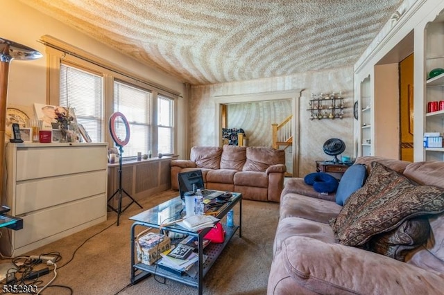 living area with a textured ceiling and carpet flooring