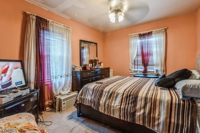carpeted bedroom featuring a ceiling fan