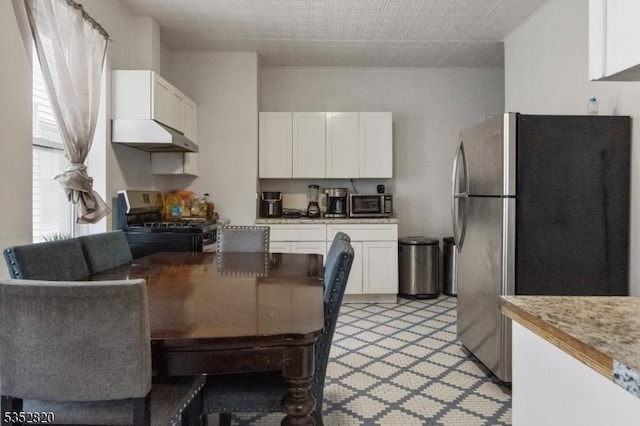 222 Van Buren St, Newark City, NJ 07105 - kitchen featuring light countertops, stainless steel appliances, and white cabinetry