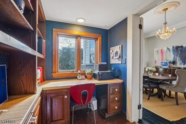 office featuring an inviting chandelier, wallpapered walls, and dark tile patterned flooring