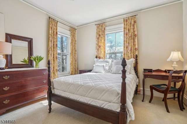 bedroom with light carpet, ornamental molding, multiple windows, and baseboards