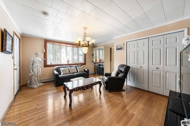 76 Kossuth St, Newark City, NJ 07105 - living area with crown molding, a chandelier, a baseboard radiator, light wood-style floors, and baseboard heating