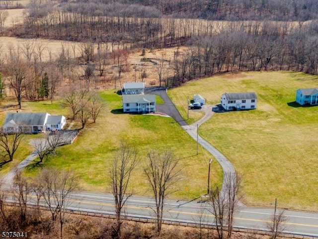 birds eye view of property with a rural view
