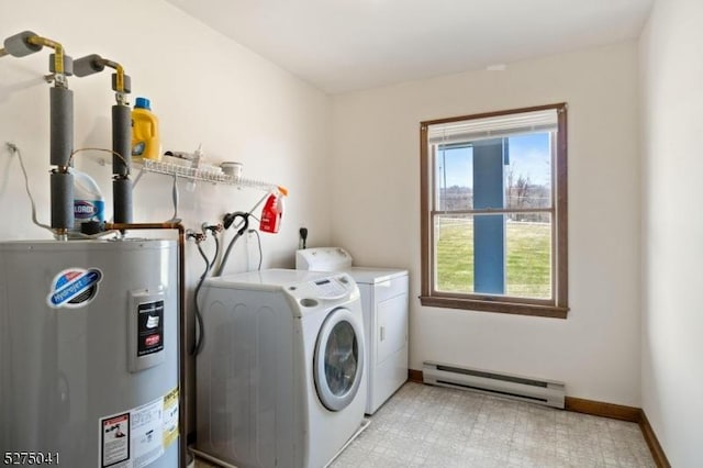 washroom featuring a baseboard heating unit, baseboards, separate washer and dryer, water heater, and laundry area