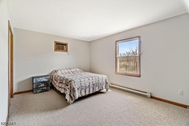 bedroom with baseboards, carpet, baseboard heating, and a wall mounted air conditioner
