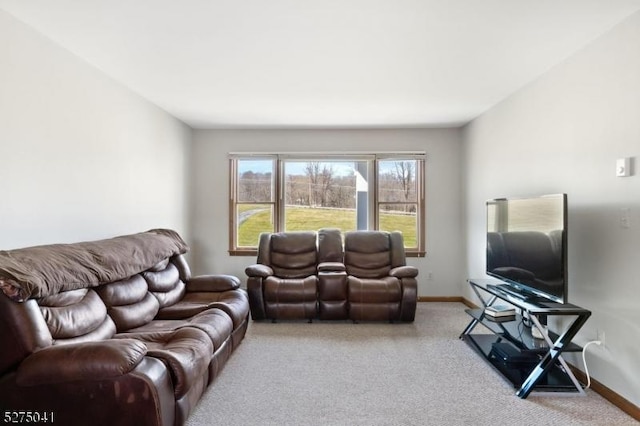 living room with light carpet and baseboards