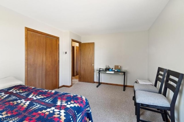 bedroom featuring carpet and baseboards