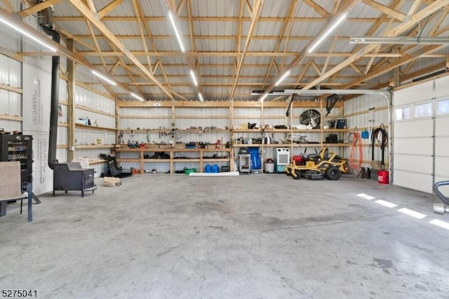 garage with a workshop area and metal wall