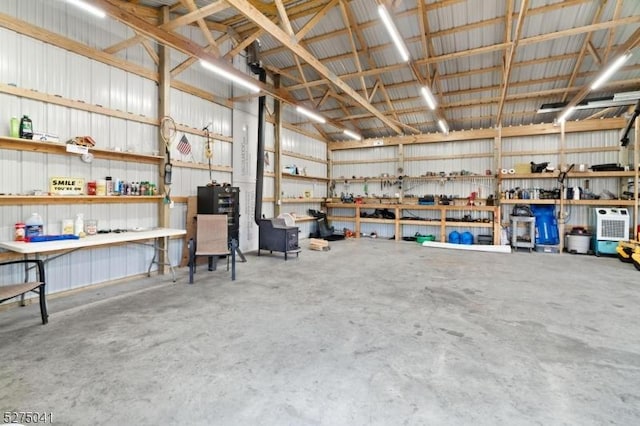 garage featuring a workshop area and metal wall