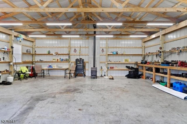 garage featuring a workshop area and metal wall