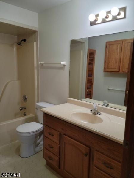 bathroom featuring tile patterned floors, vanity,  shower combination, and toilet