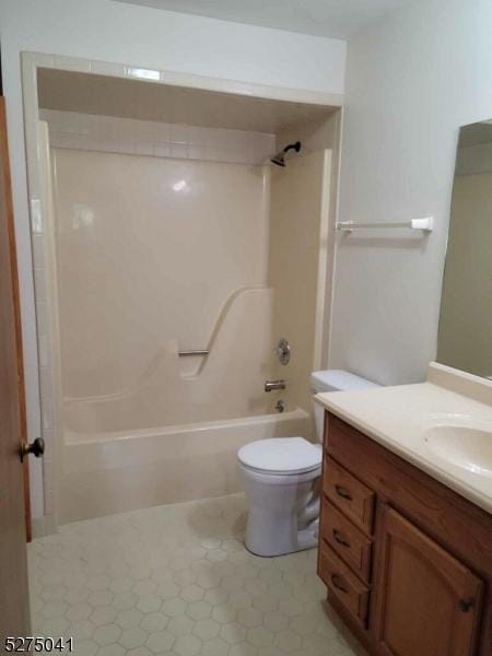 bathroom with shower / bath combination, tile patterned flooring, vanity, and toilet