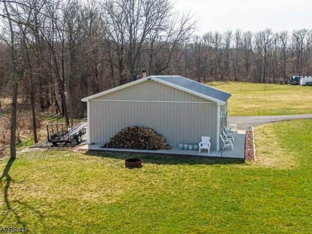 view of outbuilding featuring a wooded view