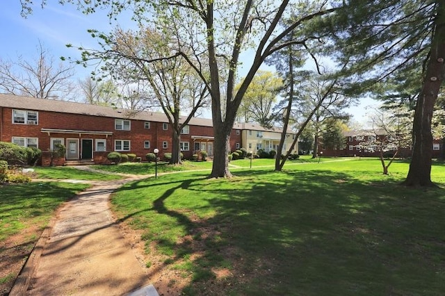 view of home's community featuring a lawn