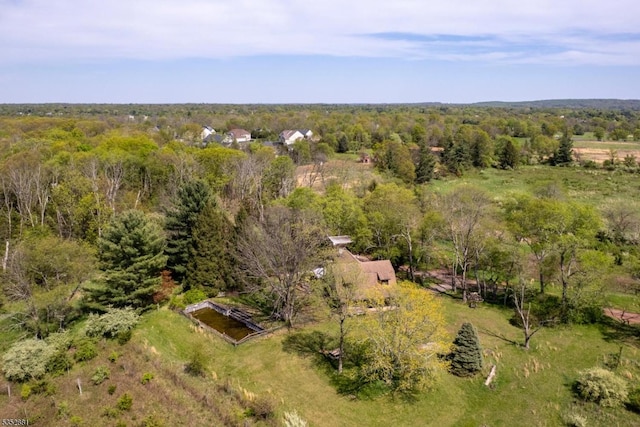 aerial view featuring a view of trees