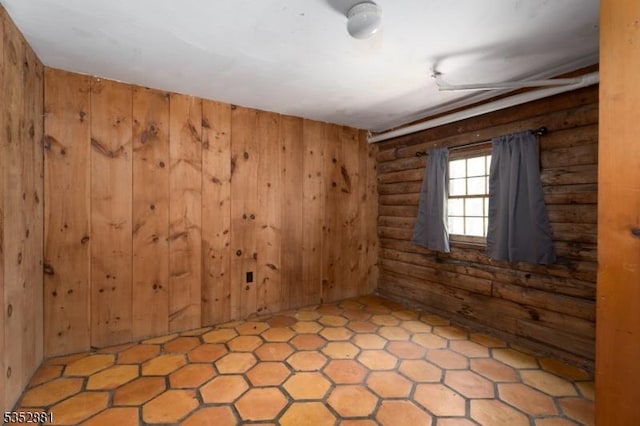 empty room featuring log walls