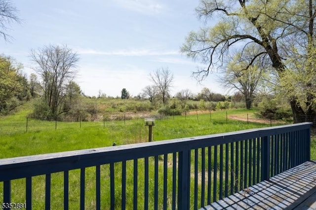 wooden terrace with a lawn