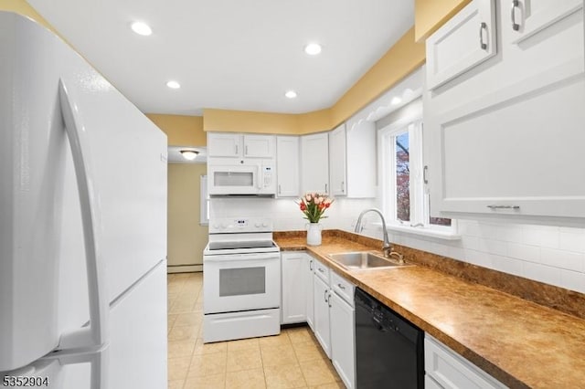 kitchen with backsplash, a sink, light tile patterned flooring, white appliances, and white cabinetry