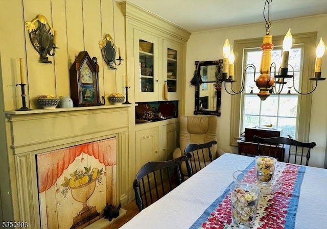 dining area with a notable chandelier and crown molding