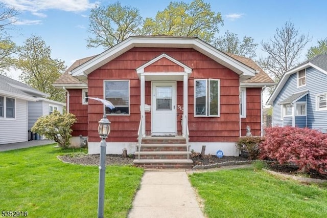 bungalow with a front lawn