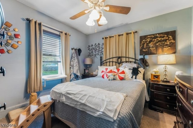 carpeted bedroom featuring a ceiling fan