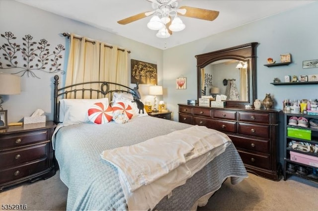 carpeted bedroom featuring a ceiling fan