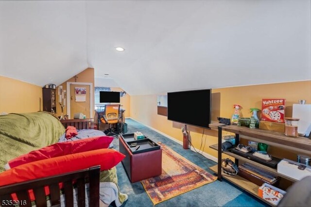 living room featuring vaulted ceiling and carpet floors