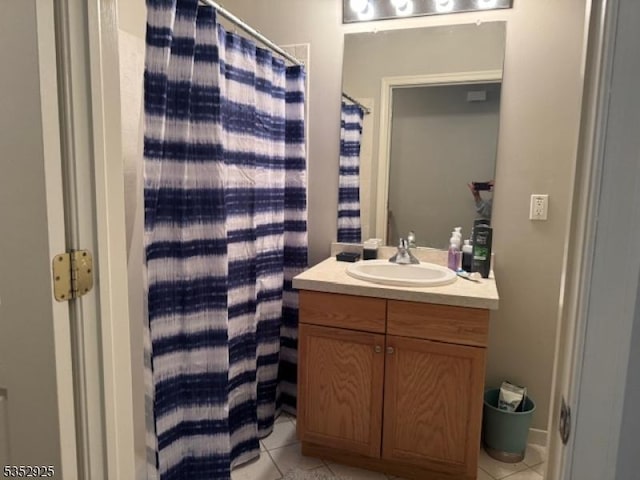 bathroom featuring a shower with curtain, tile patterned flooring, and vanity