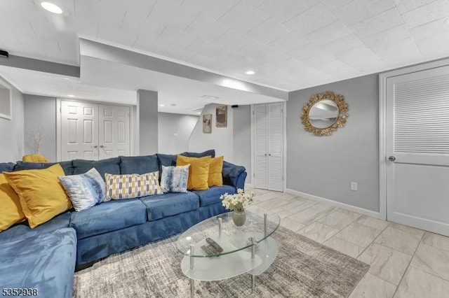 living area with recessed lighting and baseboards