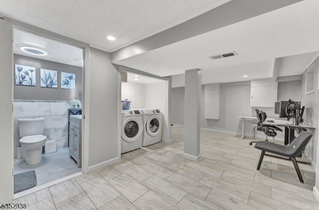 laundry room with visible vents, laundry area, and washer and dryer