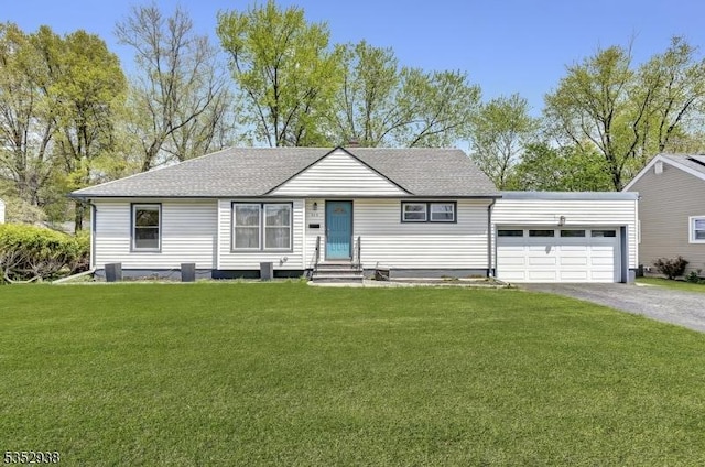 ranch-style home featuring a front lawn, roof with shingles, entry steps, an attached garage, and driveway