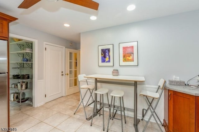 dining area with recessed lighting and light tile patterned floors