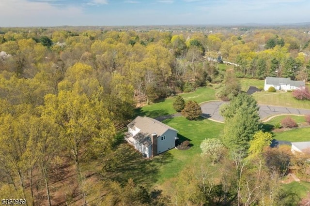 aerial view featuring a forest view