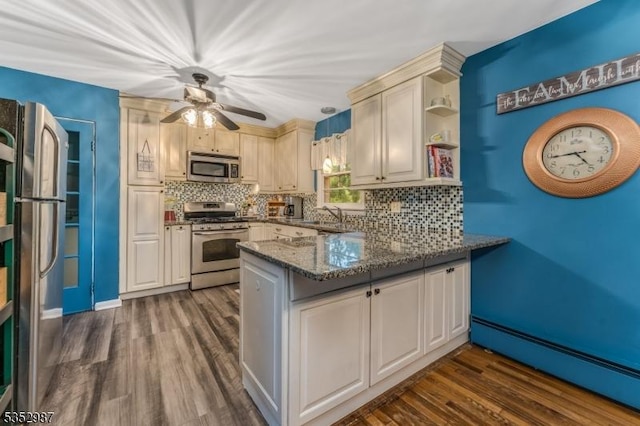 4 Broad View Pl, Raritan Twp, NJ 08822 - kitchen featuring stainless steel appliances, a peninsula, a baseboard radiator, tasteful backsplash, and dark wood-style flooring