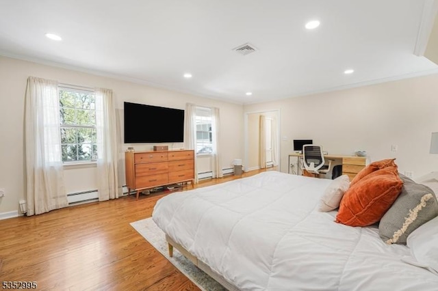 bedroom with baseboard heating, recessed lighting, visible vents, and light wood-style flooring