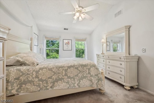 bedroom featuring carpet, vaulted ceiling, baseboards, and ceiling fan
