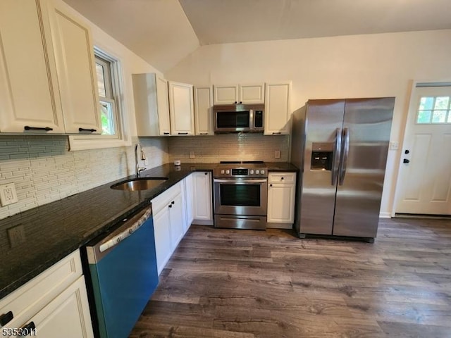 7 Raccoon Island Rd, Jefferson Twp, NJ 07849 - kitchen featuring stainless steel appliances, a sink, lofted ceiling, dark wood-style flooring, and tasteful backsplash