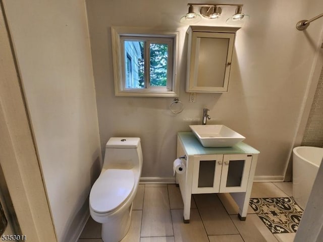 7 Raccoon Island Rd, Jefferson Twp, NJ 07849 - full bathroom featuring toilet, vanity, baseboards, and a soaking tub