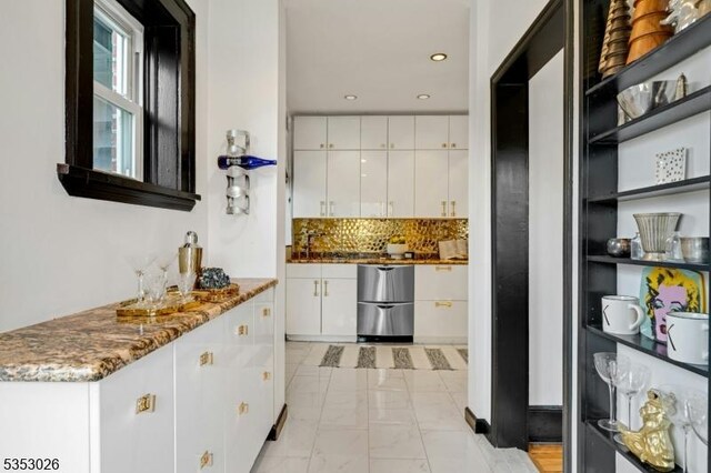 bar with dishwashing machine, decorative backsplash, marble finish floor, and recessed lighting