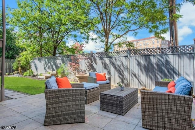 view of patio / terrace featuring an outdoor hangout area and a fenced backyard