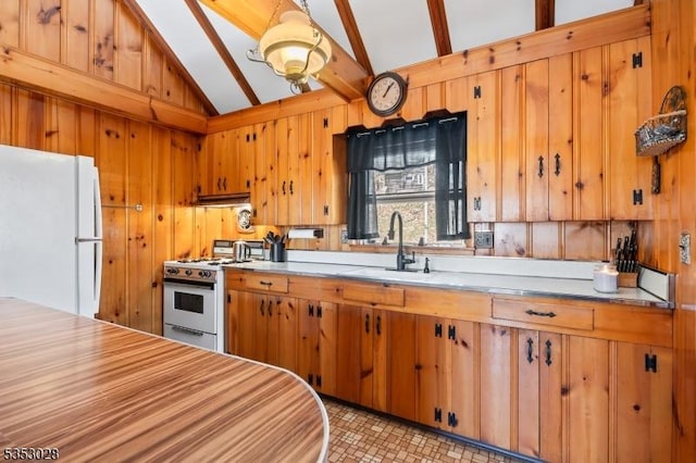 kitchen featuring lofted ceiling with beams, white appliances, brown cabinetry, light countertops, and a sink