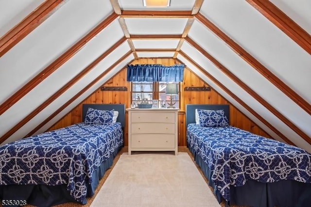 bedroom featuring wooden walls, carpet flooring, and lofted ceiling