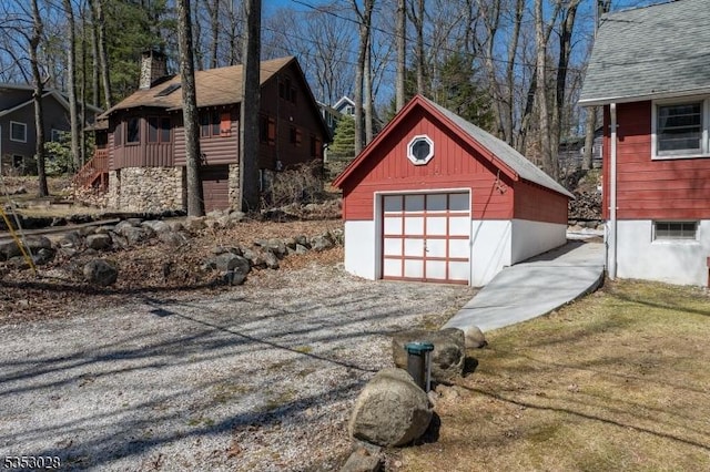 detached garage featuring driveway
